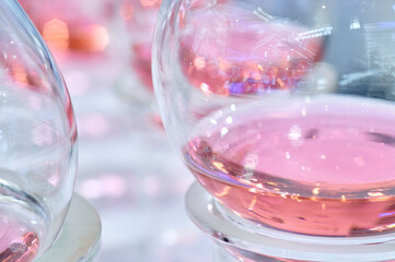 Close-up of Pink Liquid in Glass Beakers With Soft Bokeh Background