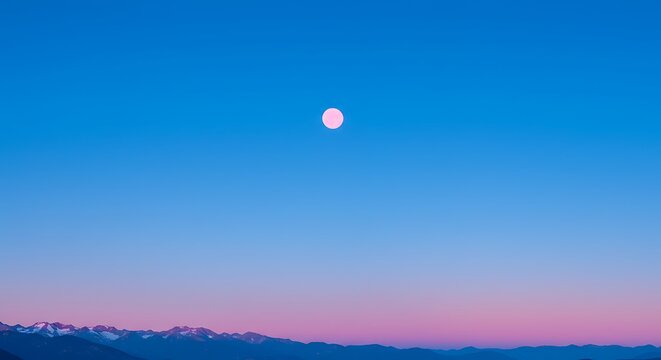 Full moon over mountain range