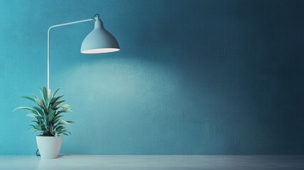 A blue lamp with a white lampshade illuminating a green plant on a white table against a blue wall.