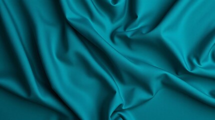 Fototapeta premium Closeup of rippled blue silk fabric cloth, studio shot.