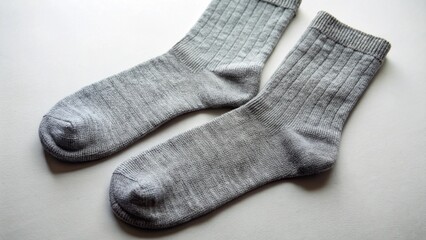 A pair of black woolen socks, isolated on a white background, representing warm winter clothing