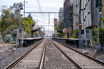 Railway tracks leading into Anstey railway station in Brunswick, Melbourne, Australia. View of the...