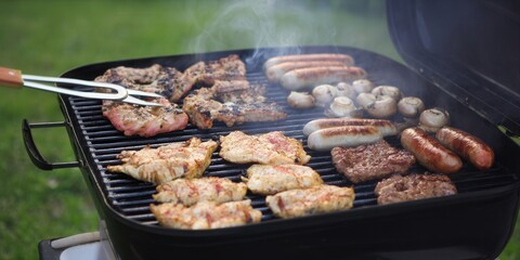 Delicious grilled meats and vegetables cooking on a barbecue during a summer gathering.