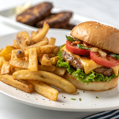 a plate of fries with a burger in the background