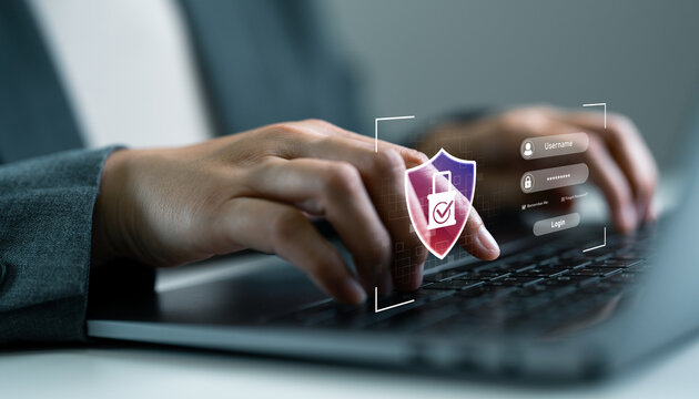 Close-up of hands typing on laptop with secure login and cybersecurity shield icon, data protection, privacy, two factor authentication and access control. Business woman using laptop.