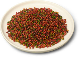 plate of green, red, and brownish-red peppercorns isolated white background, versatile spice essential for cooking and seasoning, representing rich flavor