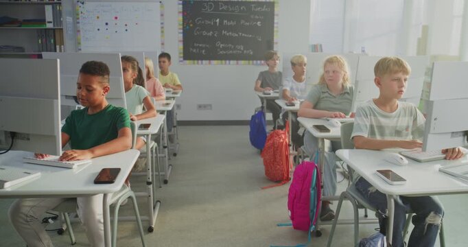 Primary School Students Working on Creative Projects on Computers. Group of Kids Practicing Digital Skills, Studying Programming in Computer Science Classroom. Interactive STEM Learning. Static Shot.