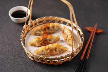 Fried Chinese dumplings filled with chicken and vegetables