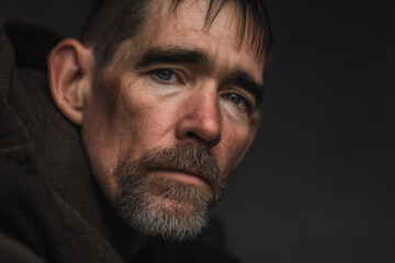 closeup portrait of american homeless man exaggerated intense emotion