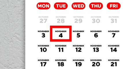 The date November 4th marked with a red cursor on the wall calendar 2025