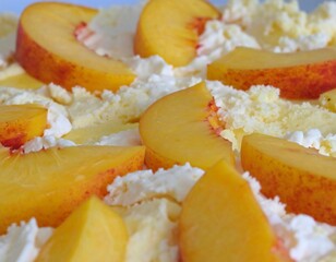 Peach slices and cream topping on a dessert