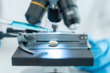 Scientist analyze biochemical samples in advanced scientific laboratory. Medical professional use microscope look microbiological developmental of viral. Biotechnology research in science lab.