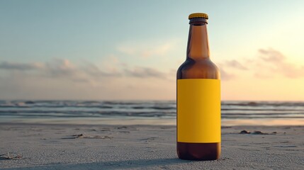Brown beer bottle with a yellow label on sandy beach against ocean and sunset sky