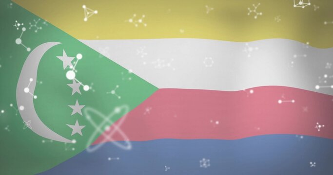 Naklejki Waving Comoros flag illustration across frame, featuring crescent, stars and floating science icons
