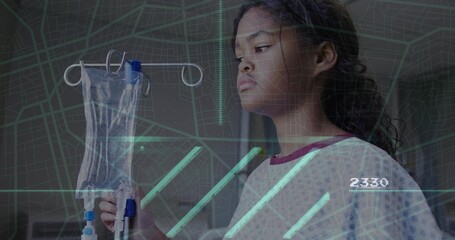 Standing child in hospital gown holding intravenous bag on IV stand in hospital, map overlay 2330