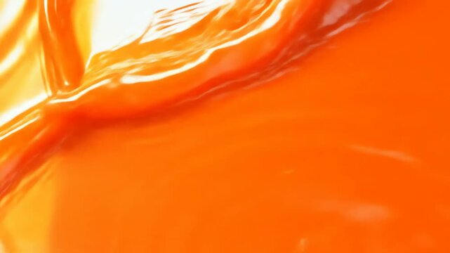 Orange liquid splashing abstract background