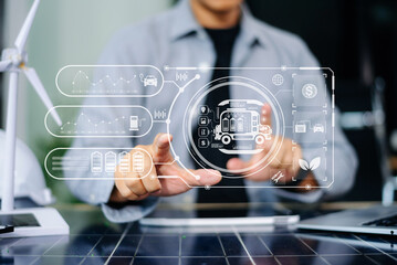 Engineer managing smart EV truck interface for clean logistics. Dashboard shows battery, solar, wind, CO2, and fleet icons in futuristic eco-transport tech network.
