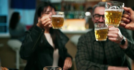 Cheers, celebration and people in pub with beer, good news and special occasion at night. Happy, friends and toast at late party with alcohol drink, milestone and achievement in social gathering.