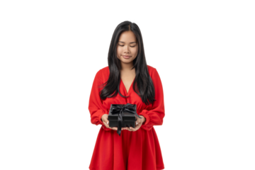 Young woman smiles gently while holding a gift box, isolated, PNG
