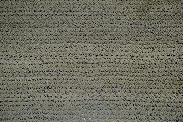 Close-up texture of woven gray rug