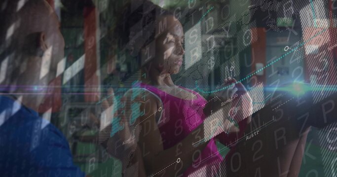 Performing female athlete pulling cable row handles in gym, with analytics overlay and trainer