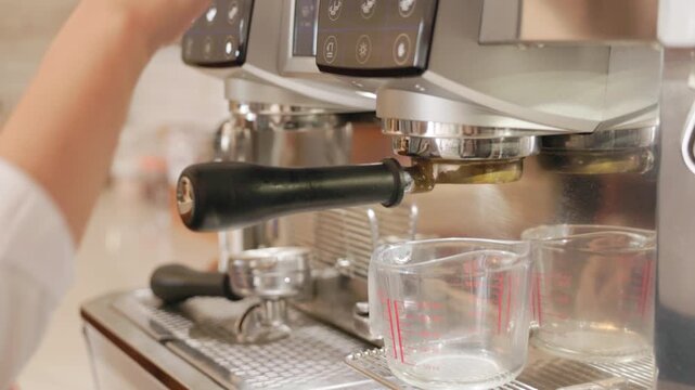 hot tea or coffee are pouring from coffee machine. 