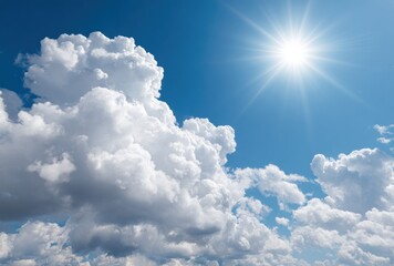 Bright sun shines over a vibrant blue sky with fluffy, voluminous white cumulus clouds creating a peaceful, open atmosphere