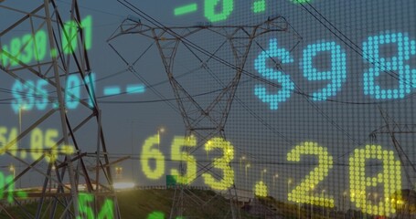 Displaying transmission tower showing pricing data along dusk highway with streetlights, headlights