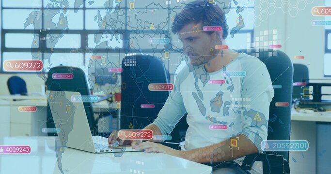 Working professional analyzing data on laptop at open-plan office, showing holographic world map