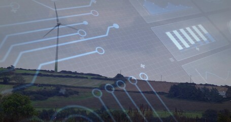 Standing wind turbine overlooking fields with hedgerows and trees on hill with circuit overlay
