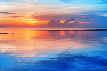 Sea beach sunset, calm ocean sunrise, beautiful peaceful tropical island landscape, idyllic...