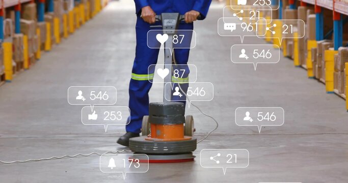 Maintenance worker in blue coveralls using floor polisher in warehouse, with digital overlay icons - Powered by Adobe