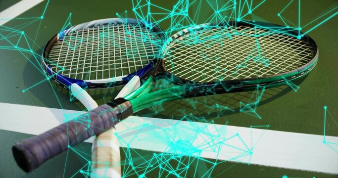Pair of tennis rackets lying crossed over boundary line on court, with neon teal network overlay - Powered by Adobe