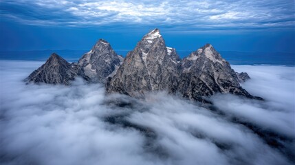 Majestic mountain peaks piercing a sea of clouds