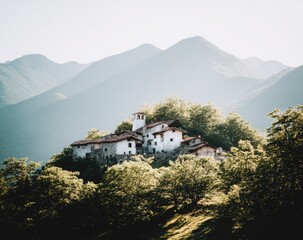 Fototapeta premium Mountaintop village nestled among trees, bathed in soft light