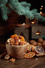 Dried fruits and nuts on an old wooden table.