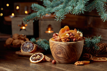 Dried fruits and nuts on an old wooden table.