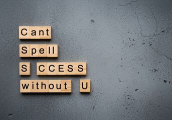 Empowering success message spelled with wooden blocks