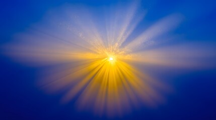 Obraz premium Radiant golden rays of sunlight burst through a vibrant blue sky, creating a beautiful celestial display.