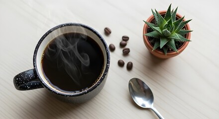 Overhead View of Coffee in Speckled black Mug with Succulent