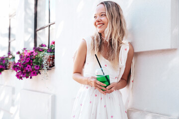 Young beautiful smiling hipster woman in trendy summer clothes. Sexy carefree model posing in the...