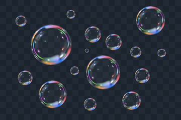 Realistic colorful soap bubbles on transparent background