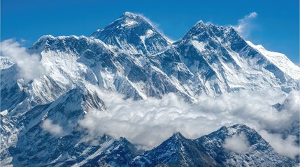 Majestic snow-capped mountain range under a clear blue sky