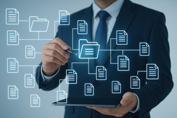 Businessman holding tablet with digital file folder and document icons representing data
