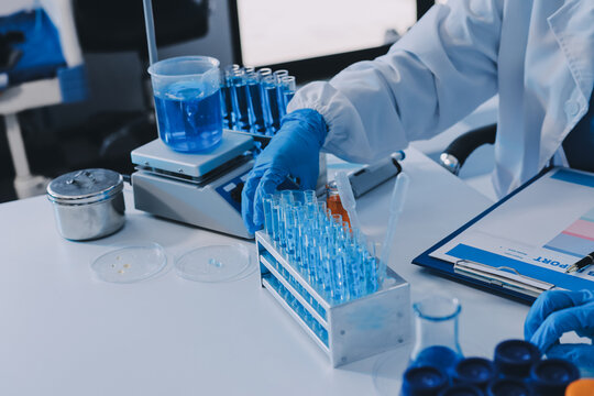 Collaboration, tablet or science with people in lab together for research or development. Innovation, tech and microscope with scientist team in clinical trial for planning or medical investigation