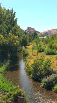 Ucero river flowing near El Burgo de Osma castle