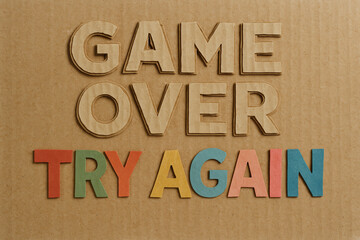 Papercut "GAME OVER" and "TRY AGAIN" Text Horizontal Video Game Illustration