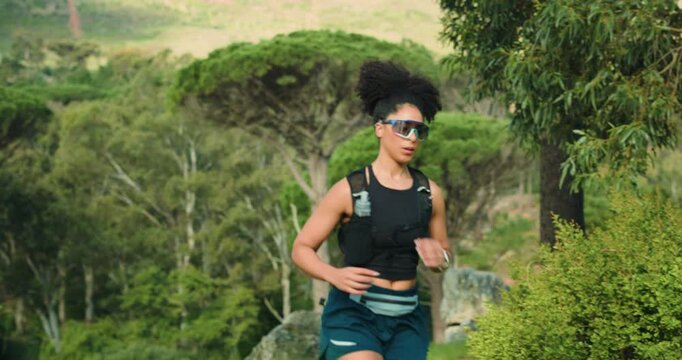 Woman, trail running and fitness in forest for workout, nature and outdoor for routine in summer. Person, athlete and challenge with cardio exercise, backpack and training for marathon in Costa Rica