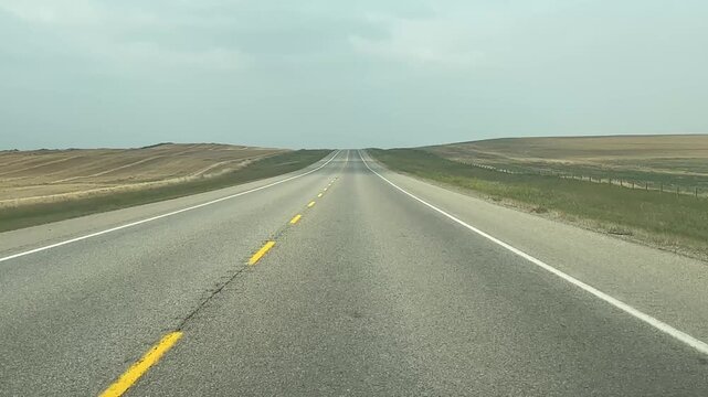 Driver&rsquo;s Perspective Through Front Window on Rural Freeway