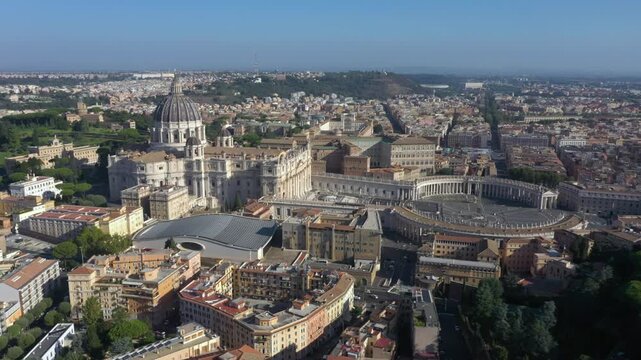 Aerial drone spinning over St. Peter&rsquo;s Basilica, its majestic dome, and the vast Piazza San Pietro, symbolizing the heart of the Catholic Church and Rome&rsquo;s timeless beauty.